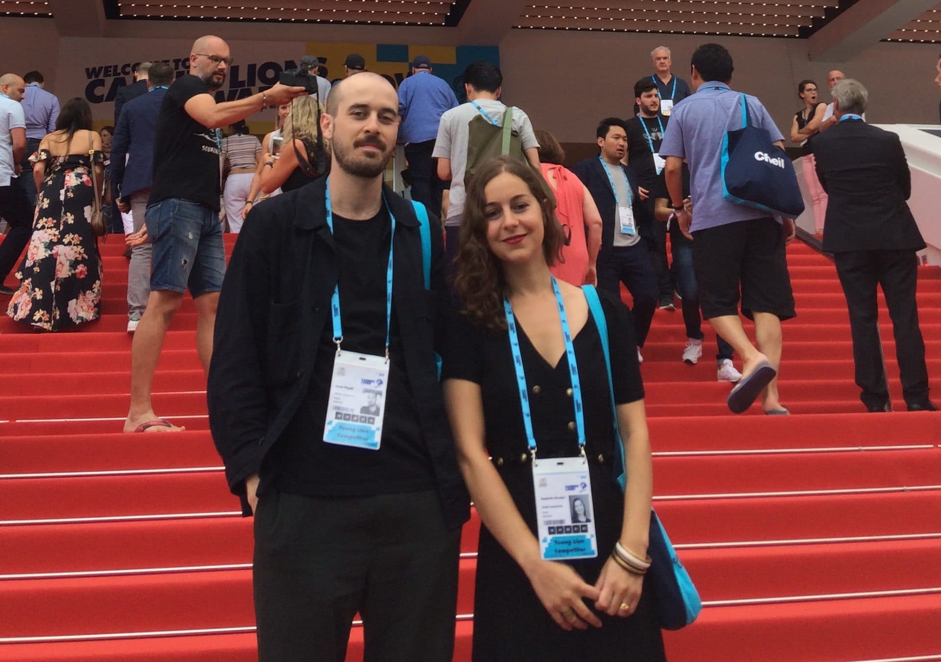 Image of two employees at Cannes on a red carpet