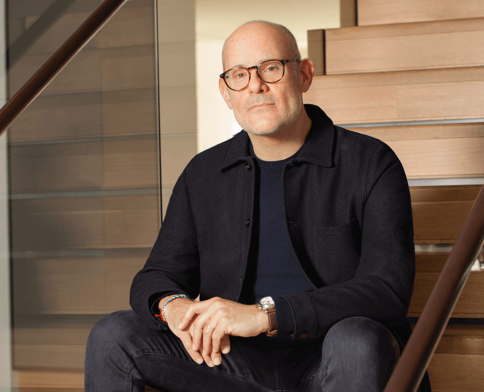 Headshot of Michael sitting on steps