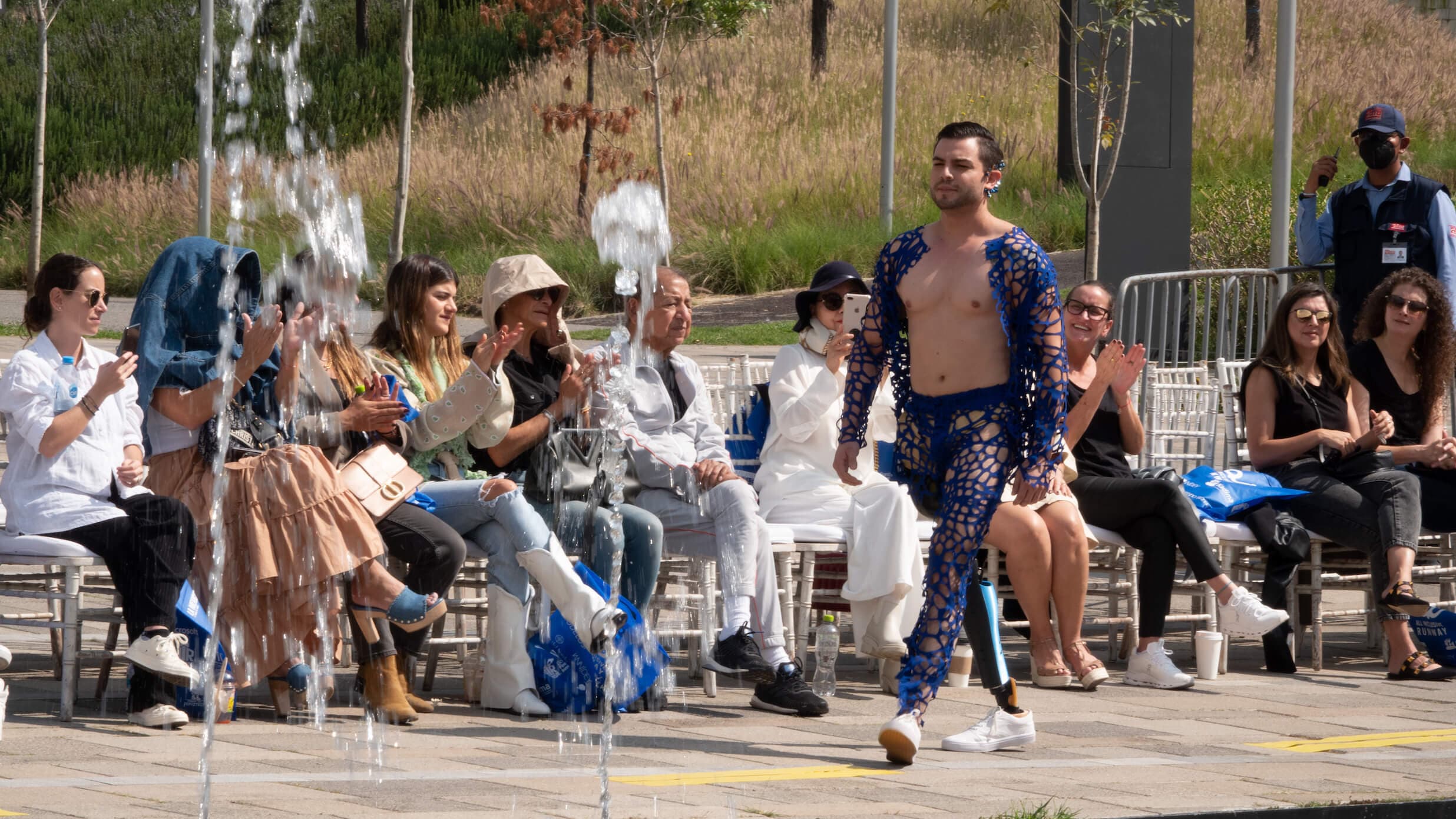 All inclusive runway image with models walking the runway