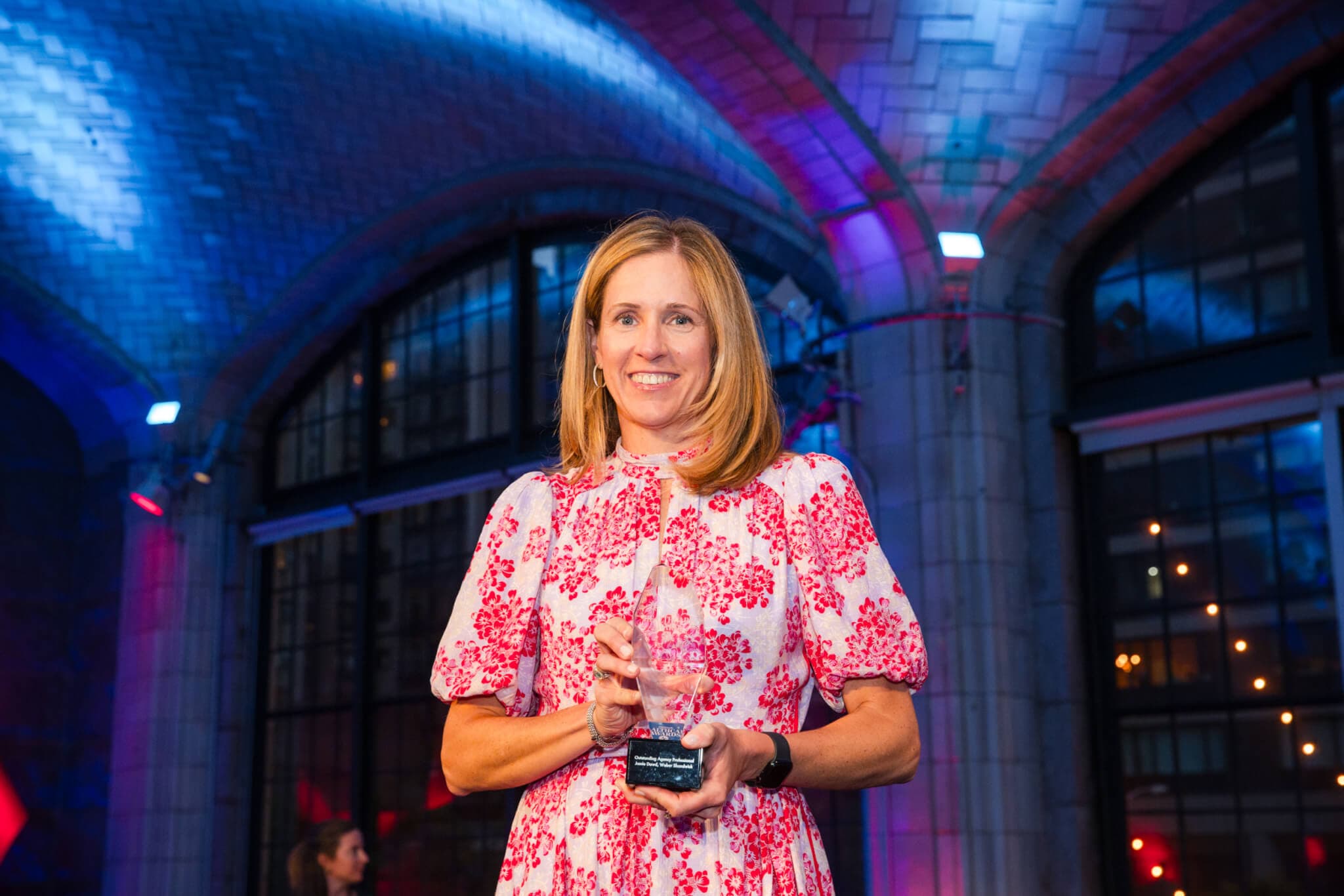 Weber Shandwick President, Health, Americas holds a statue at the 2024 PRWeek Healthcare Awards for Outstanding Professional