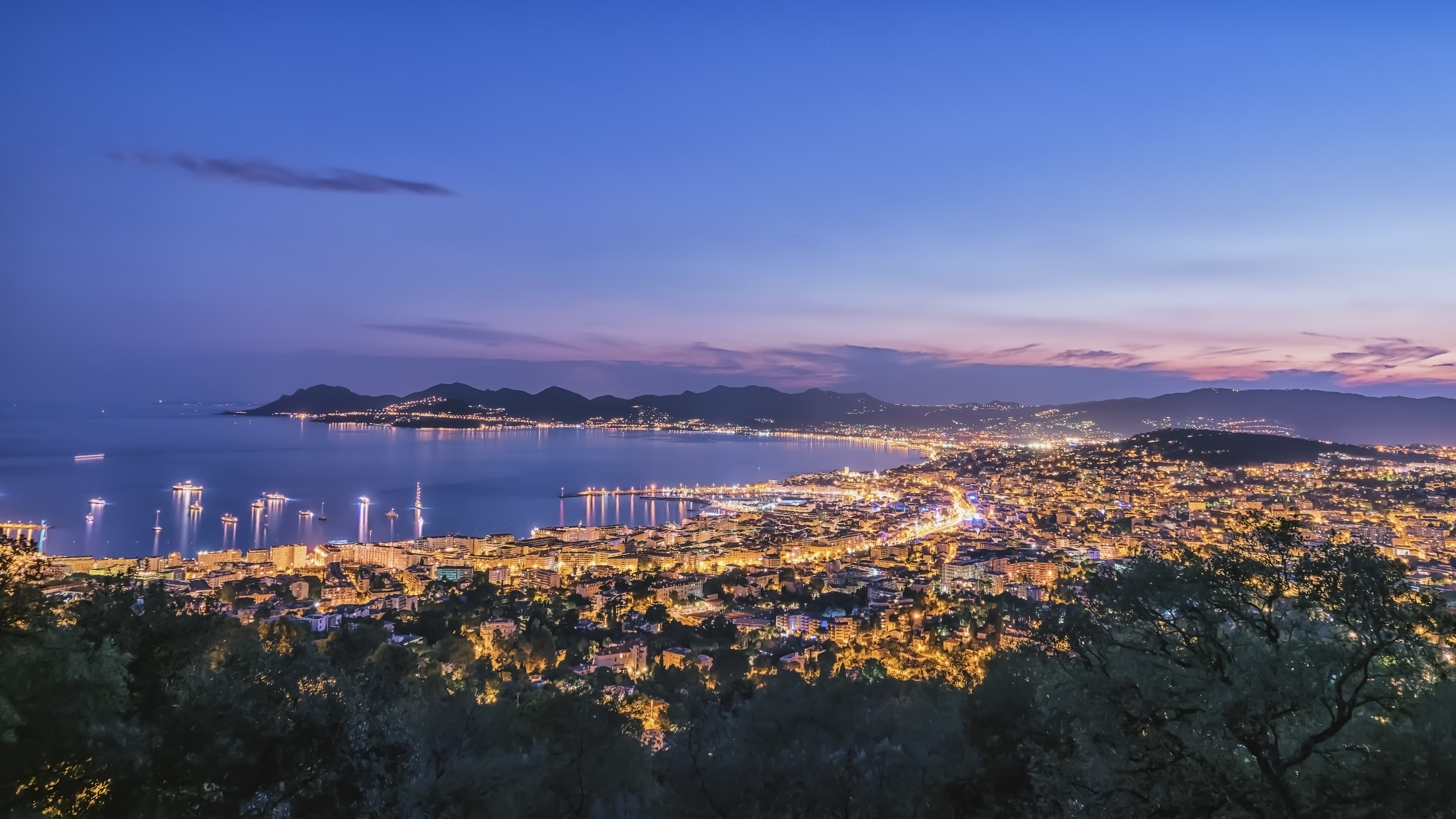 Nighttime Cannes city panorama in France