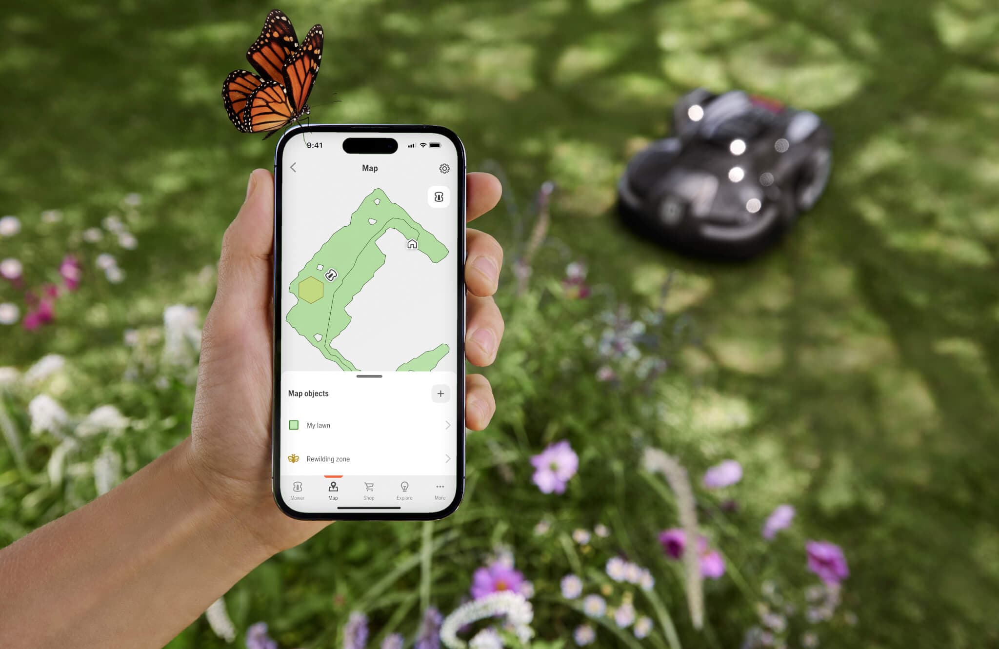 Image of smartphone with the map of the lawn showing full area and the area marked off to remain wild.