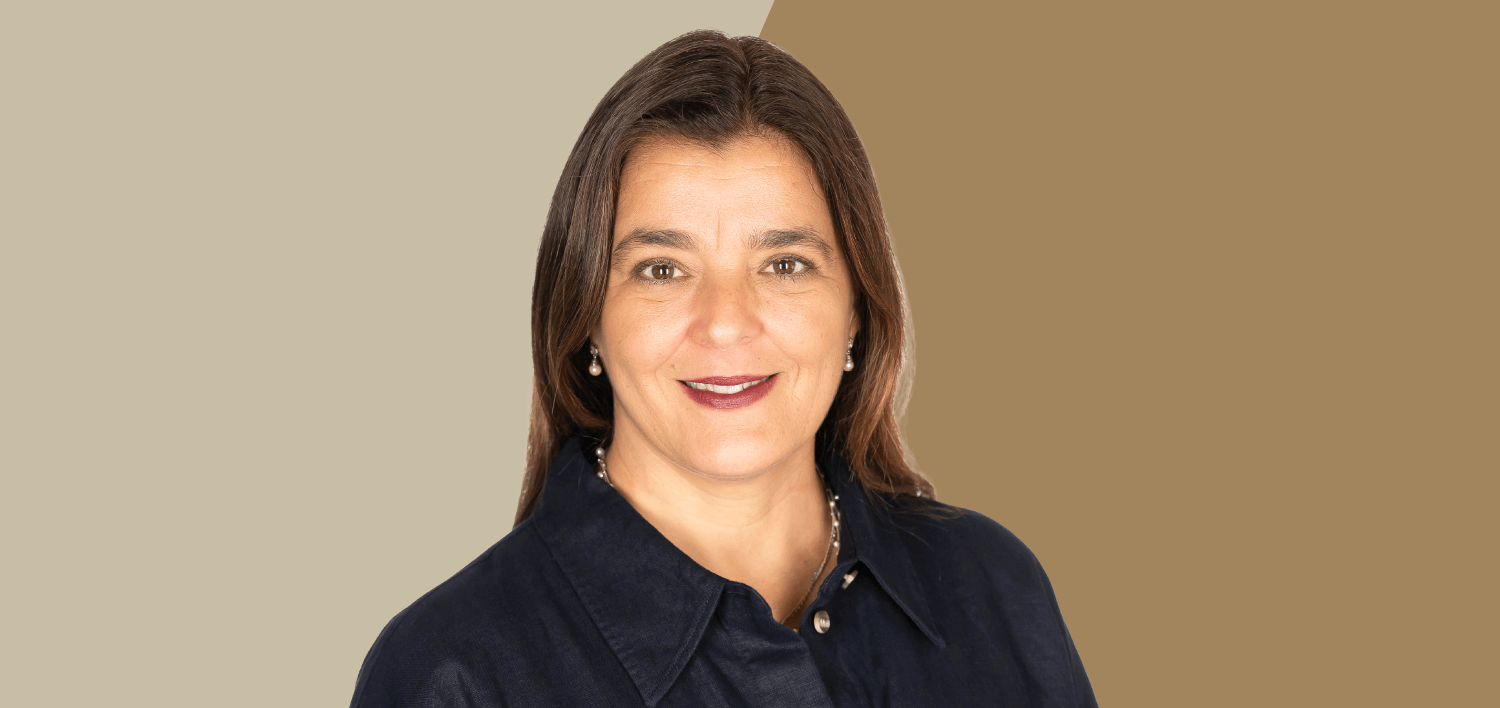 Image of a woman with dark staight hair wearing a dark shirt looking direct to camera