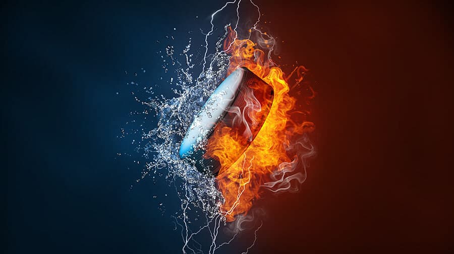 Ice hockey puck exploding by elements fire and water