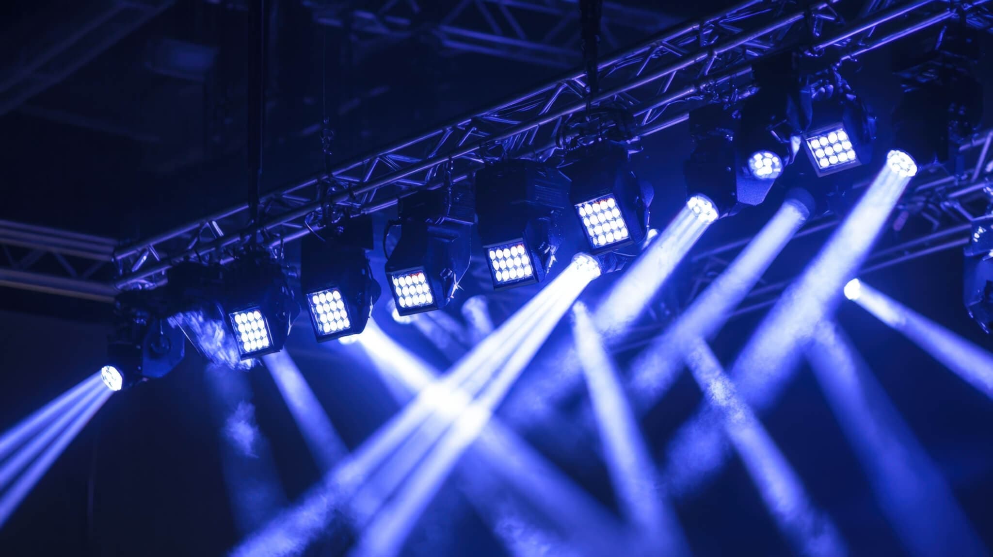 Stage lighting with spotlights being installed on aluminum concert stage. High quality photo