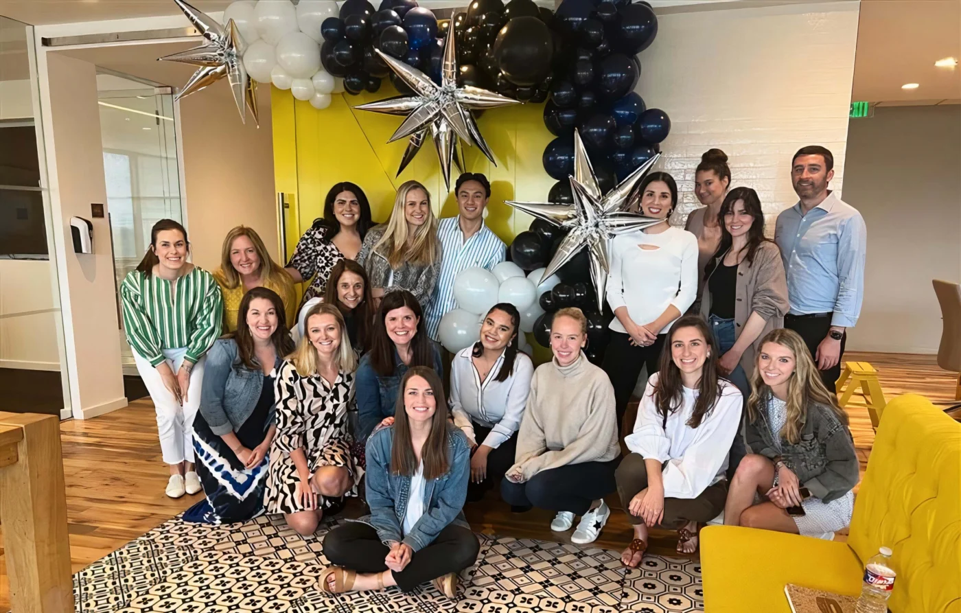 Weber Shandwick Dallas team group photo in office, celebrating workplace culture with staff gathered in collaborative Texas workspace