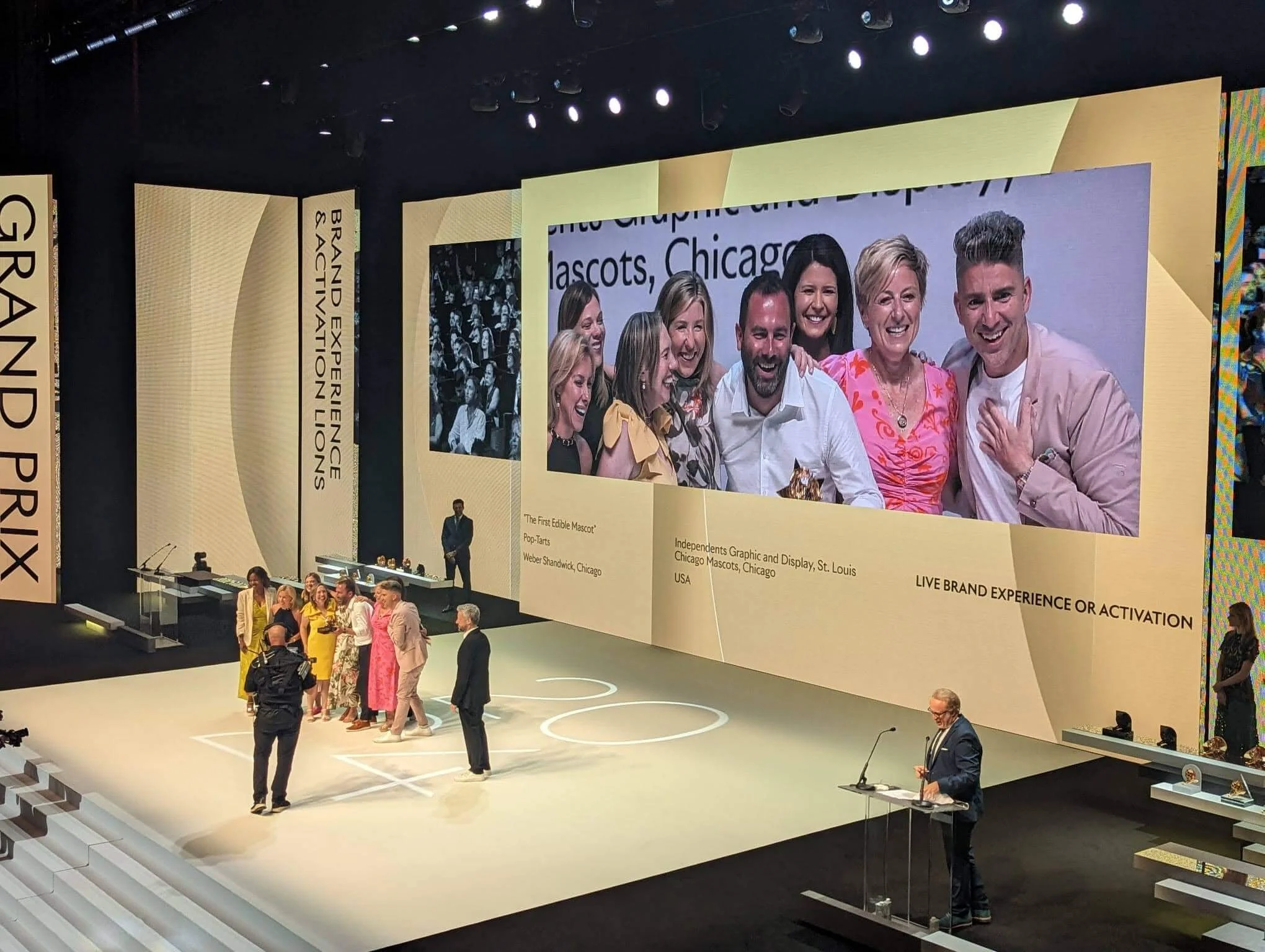 Weber Shandwick team on stage at Cannes Lions accepting Grand Prix for brand experience campaign, celebrating award-winning creative work
