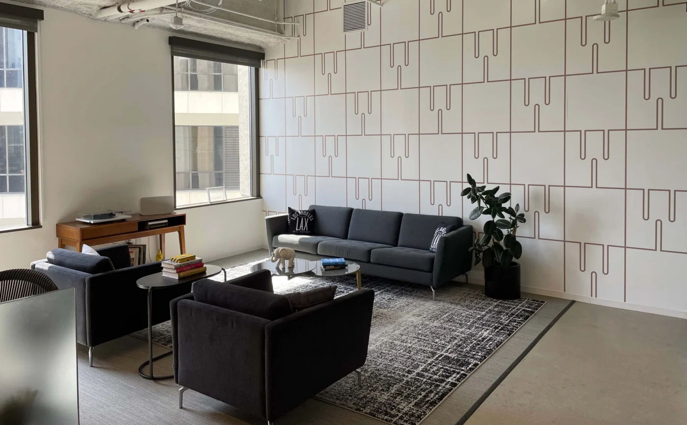Weber Shandwick Los Angeles office lounge area with modern seating and decor, showcasing collaborative workspace environment in California