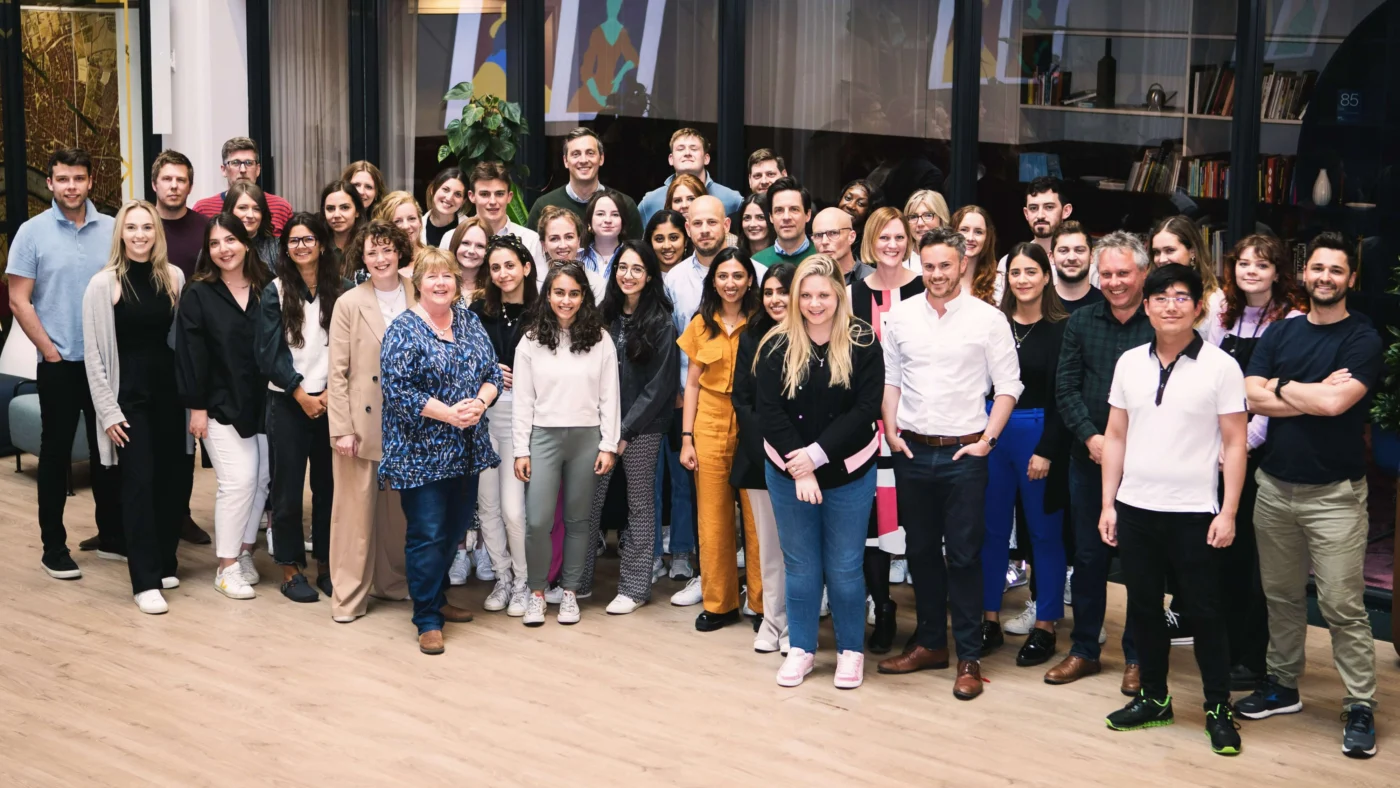 Weber Shandwick London team group photo in office, representing diverse talent at intersection of financial and creative districts