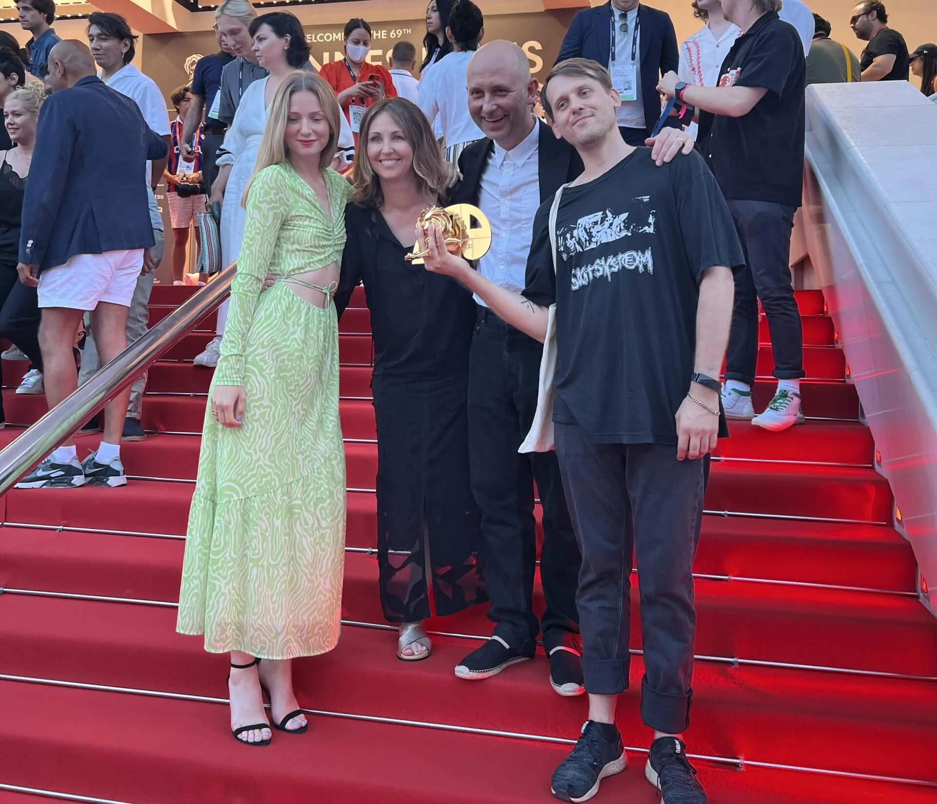 Weber Shandwick team celebrates Cannes Lions wins on red carpet steps, showcasing award recognition with clients