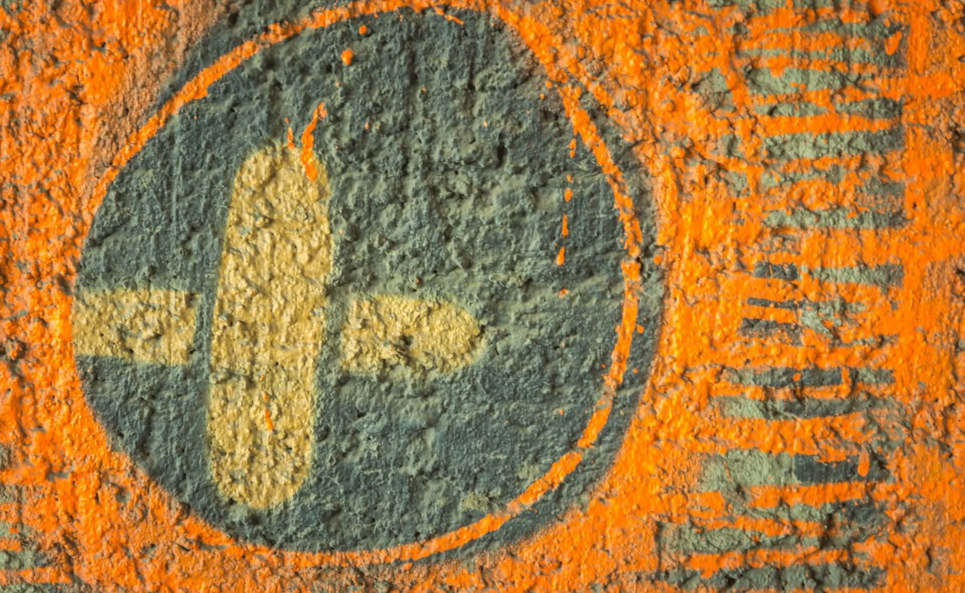 Textured surface with bold painted symbol, representing brand building, marketing creativity and strategic communications at Weber Shandwick